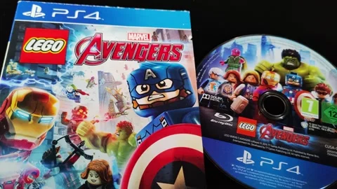 The cover and Blu-ray Disc of the game Lego Marvel Avengers - PS4 Stock Footage 283681044