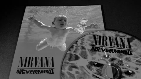 The cover and CD of Nevermind, by the American band Nirvana Stock Footage 296995352