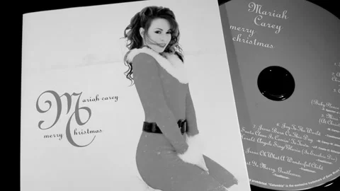 The cover and CD of the studio album Merry Christmas by Mariah Carey Stock Footage 282596573