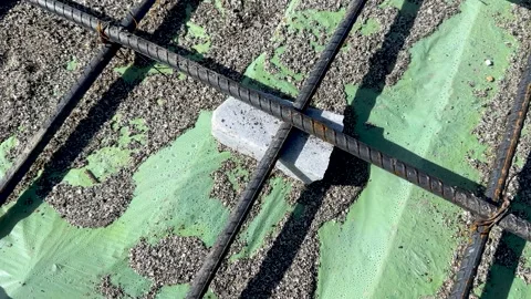 Cover block or spacer is use to lift the rebar mesh off the ground so that .. Stock Footage 294873445