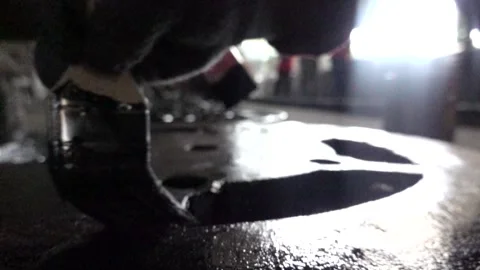 Cover the gutter painted black with a brush Stock Footage 259862929