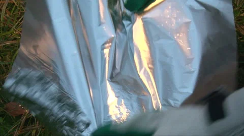 Cover hand made braizer from a cut a tin can of canned food with a foil Stock-Footage 63210355