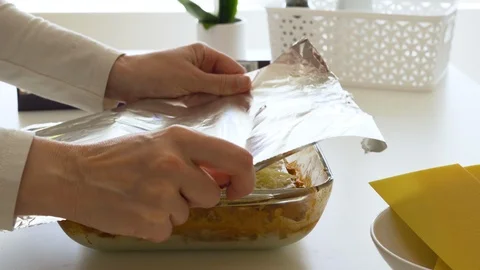 Cover lasagna with foil before baking Stock Footage 127150760