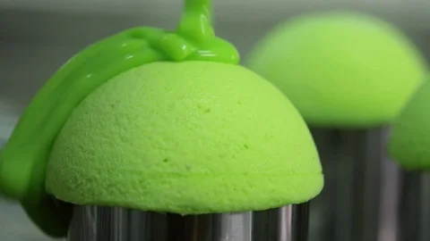 Cover with liquid glossy glaze cake close-up. Glaze flows to the cake. Cook Stock Footage 74717033