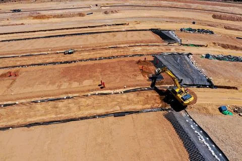 Coverage of clay-type material on geosynthetics in mine fill Stock Photos