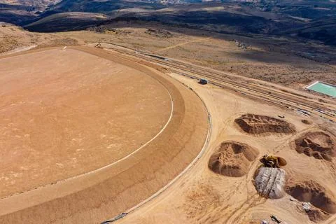 Coverage of clay-type material on geosynthetics in mine fill Stock Photos