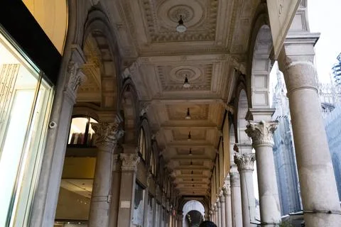 Covered arcade in Milan's main square near the Duomo, featuring elegant arche Stock Photos