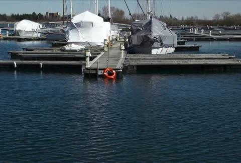 Covered Boats awaiting Springtime NTSC Stock Footage 10864734