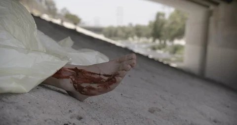 Covered Body Under Bridge Close Up Feet Hand Held Crime Scene Stock Footage 90876472