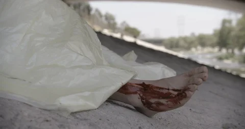 Covered Body Under Bridge Close Up Feet Crime Scene Stock Footage 90876479