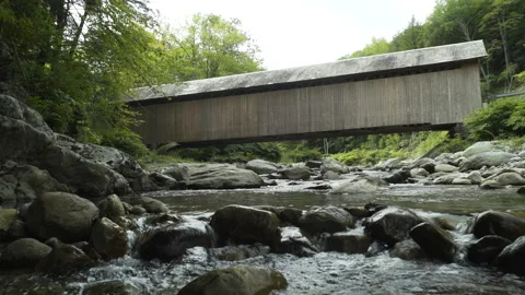 Covered Bridge over Babbling Brook Stock Footage 131758117