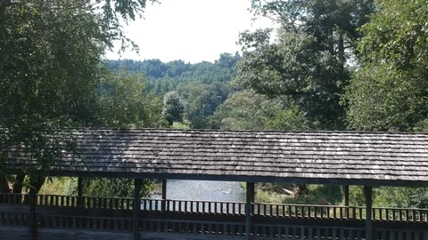 Covered bridge over river 库存影片 113487896