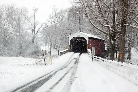 Covered bridge in snow Stock Photos
