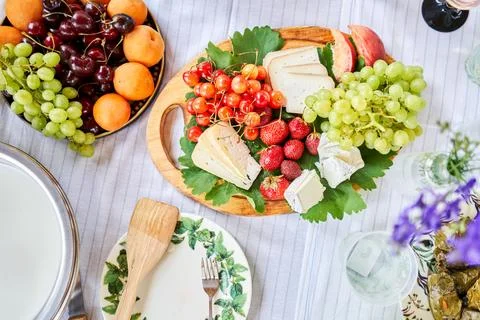 A covered buffet table for a master class. Cheeses, fruits and nuts. Master Stock Photos