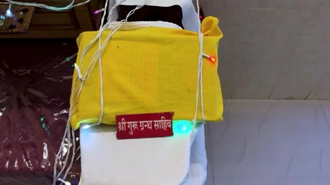 Covered Guru Granth Sahib the holy scripture of Sikhism during religious ce.. Видео 321348890