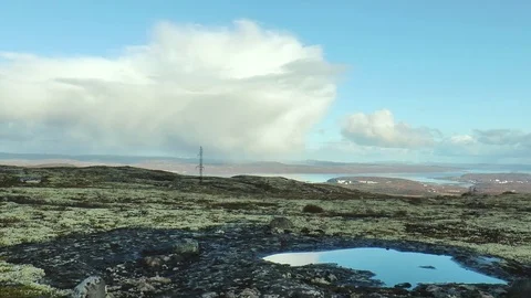 Covered with moss plateau against the river and hills with city in the distance. Stock Footage 75419494