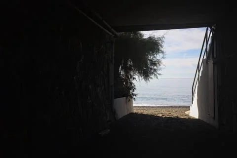 Covered passage to the beach Stock Photos