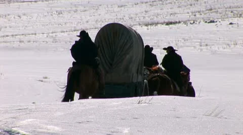 Covered Wagon in winter on western plains Stock Footage 11364290