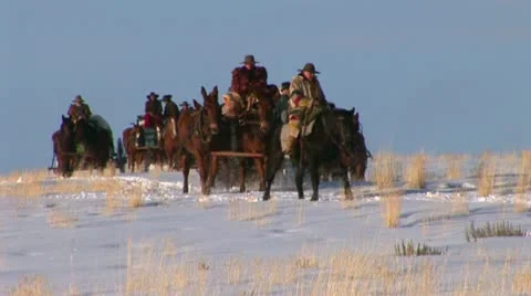 Covered Wagon in winter on western plains Stock Footage 11364396