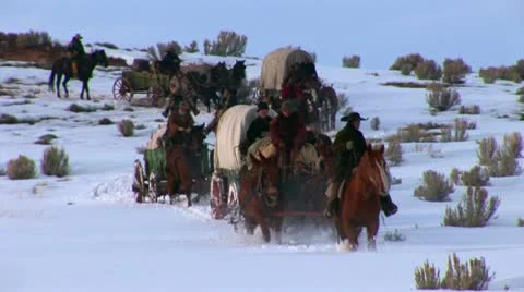 Covered Wagon in winter on western plains Stock Footage