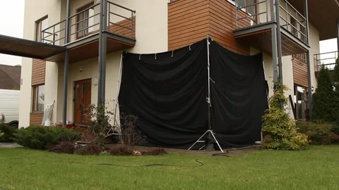 Covered windows from the outside with black fabrics for filming purposes Stock Footage 238003351