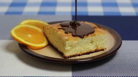 Covering a cake with chocolate Stock Footage 70339317