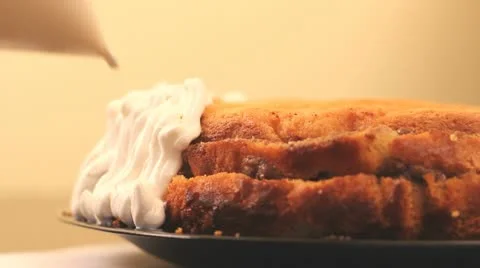 Covering a cake with cream Stock Footage 12303502