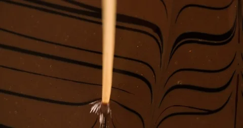 Covering Cake surface with melted Chocolate lines Close up Stock Footage 102620952