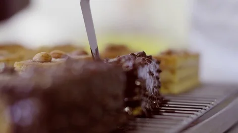 Covering each side of the cake with chocolate glaze Stock Footage 72256523