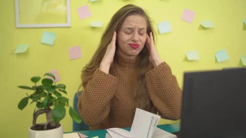 Covering Ears as if Hearing Something Unexpected Woman at Laptop Workspace on Stock Footage 306654668