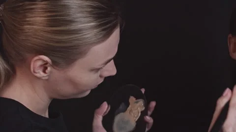 Covering Face with Foundation Stock Footage