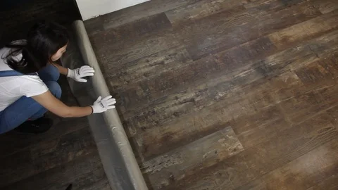 Covering the floor with foil Stock Footage 101861996