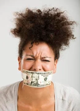 Covering mouth with a dollar banknote Stock Photos