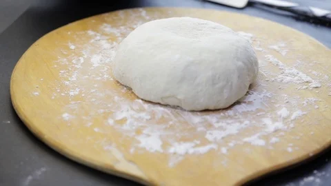 Covering raw bread Stock Footage 121120744