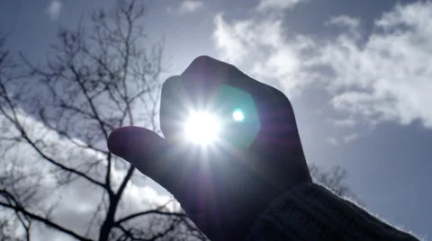 Covering the sun with hand Stock Footage 35423372