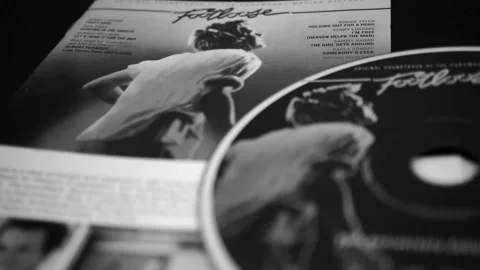 Covers and cd of the edition for the 15th anniversary of FOOTLOOSE Stock Footage 233279083