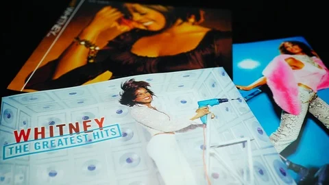 Covers and cd inserts of the American singer and actress Whitney Houston Stock Footage 104576423