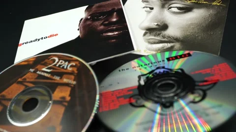 Covers and cd inserts of the rap stars Tupac Shakur and NOTORIUS BIG Stock Footage 131113994