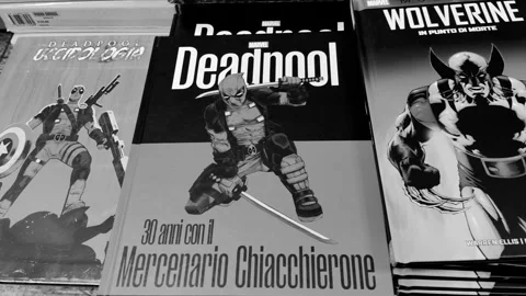 The covers of the books Deadpool and In the Point of Death. Wolverine Stock Footage 285957182