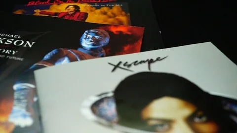 Covers of three CDs by the American singer, and dancer, MICHAEL JACKSON Stock Footage 105745769