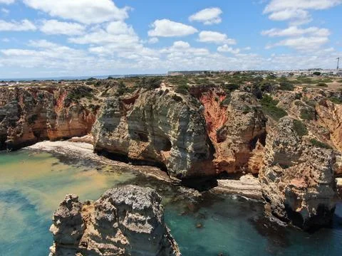 Coves between the rocks of a cliff. Stock Photos