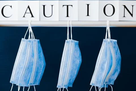 Covid-19 alert, text "Caution" Stock Photos