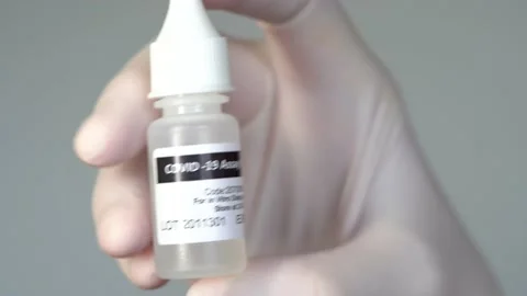 Covid-19 assay buffer sample to detect coronavirus via Antigen test. 스톡 동영상 146773181