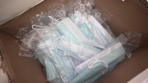 COVID-19 Box Full of Protective Medical Masks Stock Footage 132993415