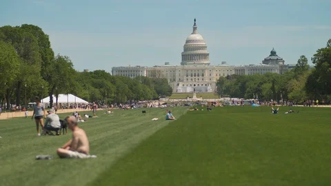 Covid-19 Capitol Hill Lawn People Outside Amid City Lockdown Coronavirus 4K Video stock 129965053