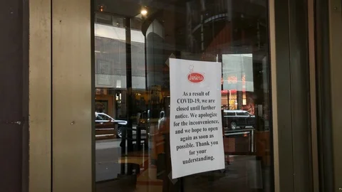 COVID-19 closes bars and restaurants. Juniors Restaurant Times Square CLOSED Stock-Footage 126558288