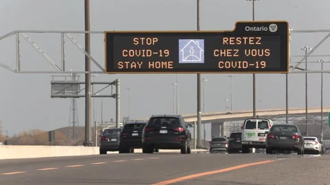 COVID 19 coronaviris pandemic lockdown sign on highway in Toronto Canada Stock Footage 151661767