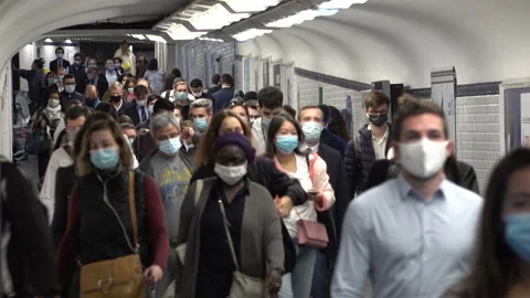 Covid-19 coronavirus pandemic, crowds of subway passengers with face masks Paris Stock Footage