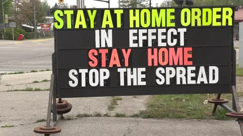 COVID 19 coronavirus pandemic public health  warning signs social distancing Stock Footage