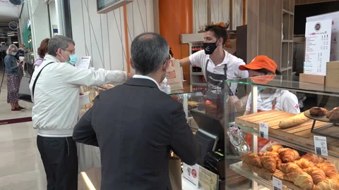 Covid-19 coronavirus second wave Europe, face masks bakery Paris France Stock Footage 139745071